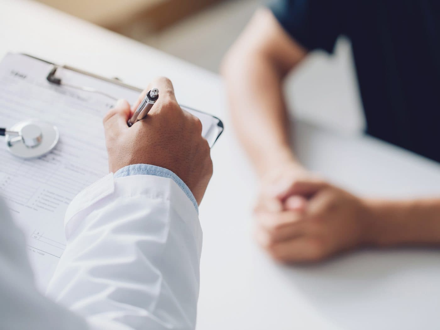 A physician consulting with a patient
